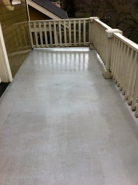 Deck surface after pressure washing, clean and restored