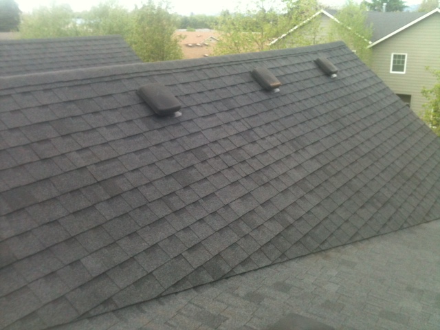 The same style of composition shingle roof at a Portland multi-family property, fully clean after JNR's roof cleaning