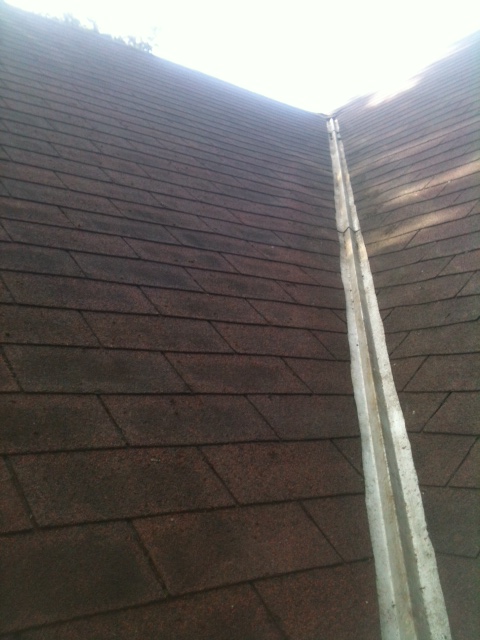 Clean roof valley free of moss and debris after service